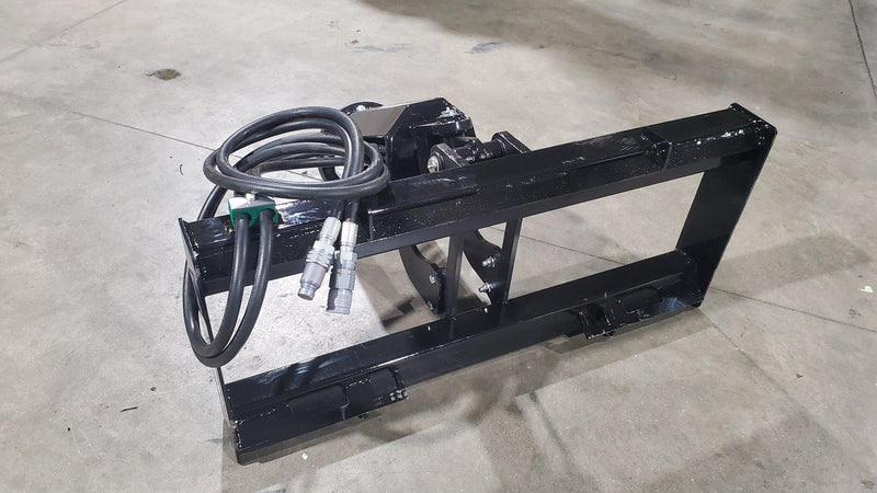 Load image into Gallery viewer, Black hydraulic quick attach adapter for skid steer on concrete floor
